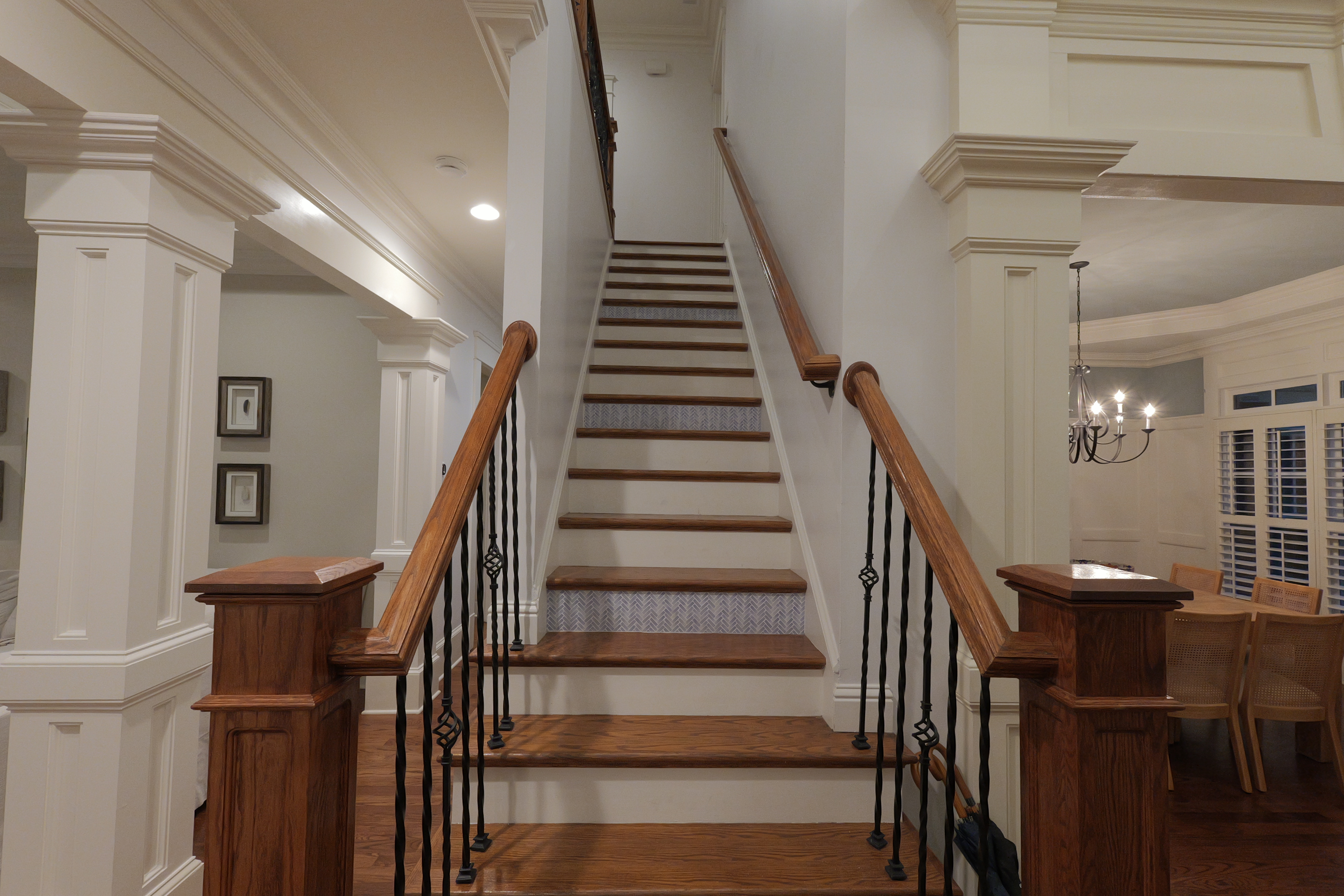 Grand staircase — wrought iron balusters and oak treads